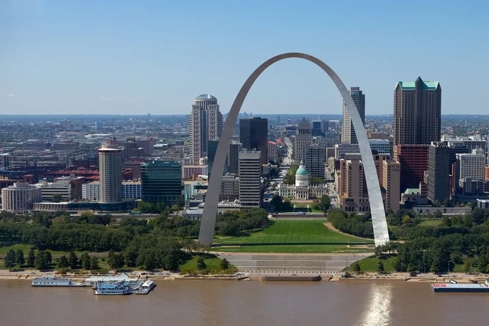 The Gateway Arch rising above downtown buildings and the Mississippi River in St. Louis, Missouri